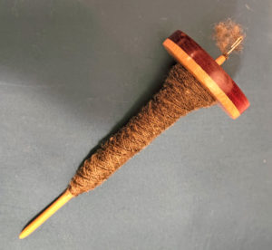 Top whorl wooden spindle with spun yarn