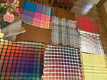 handwoven fabric samples in various colors